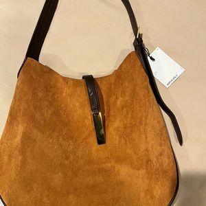 Brown FAUX Suede bag. Can be used cross body or shoulder. Adjustable strap